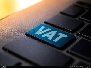 close-up of a black keyboard, 
with the word VAT written on one key