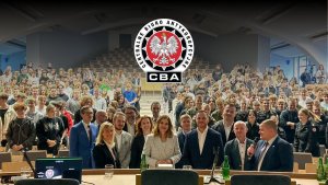 A photo of the auditorium filled with CBA representatives and students.