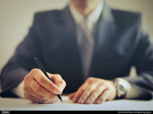 close-up of hands holding a pen